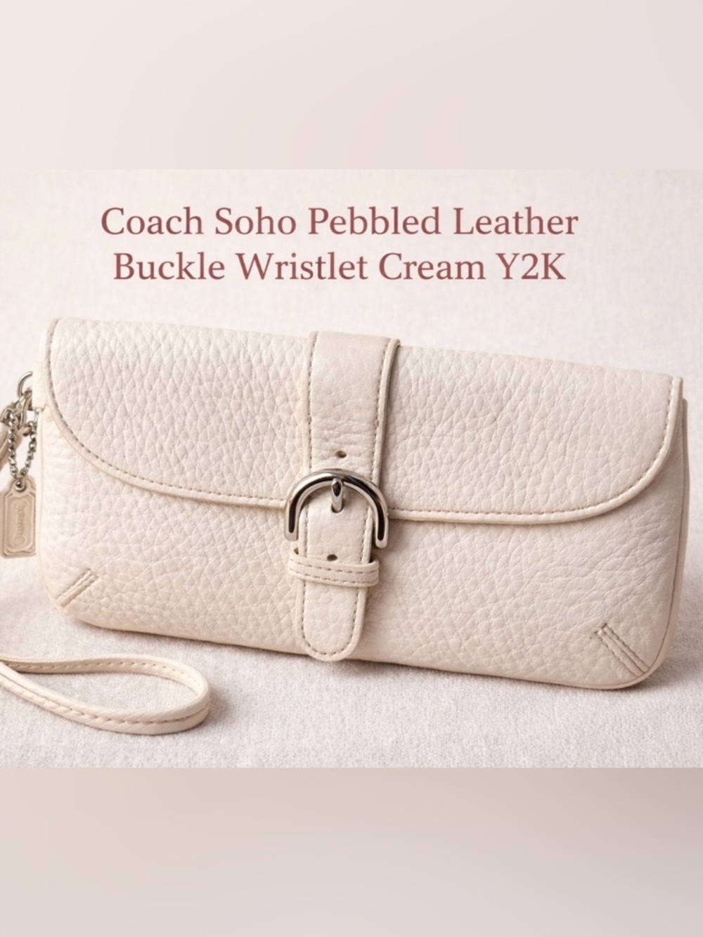 Coach Cream Pebbled Leather Soho Buckle Wristlet